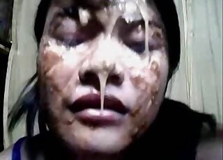 Her face is covered but she wants to eat even more