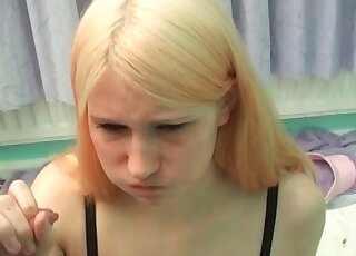 Lovely blonde is on her knees and she gobbles up pee